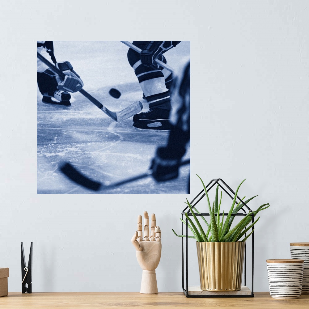 A bohemian room featuring Ice hockey players fighting for puck (B&W)