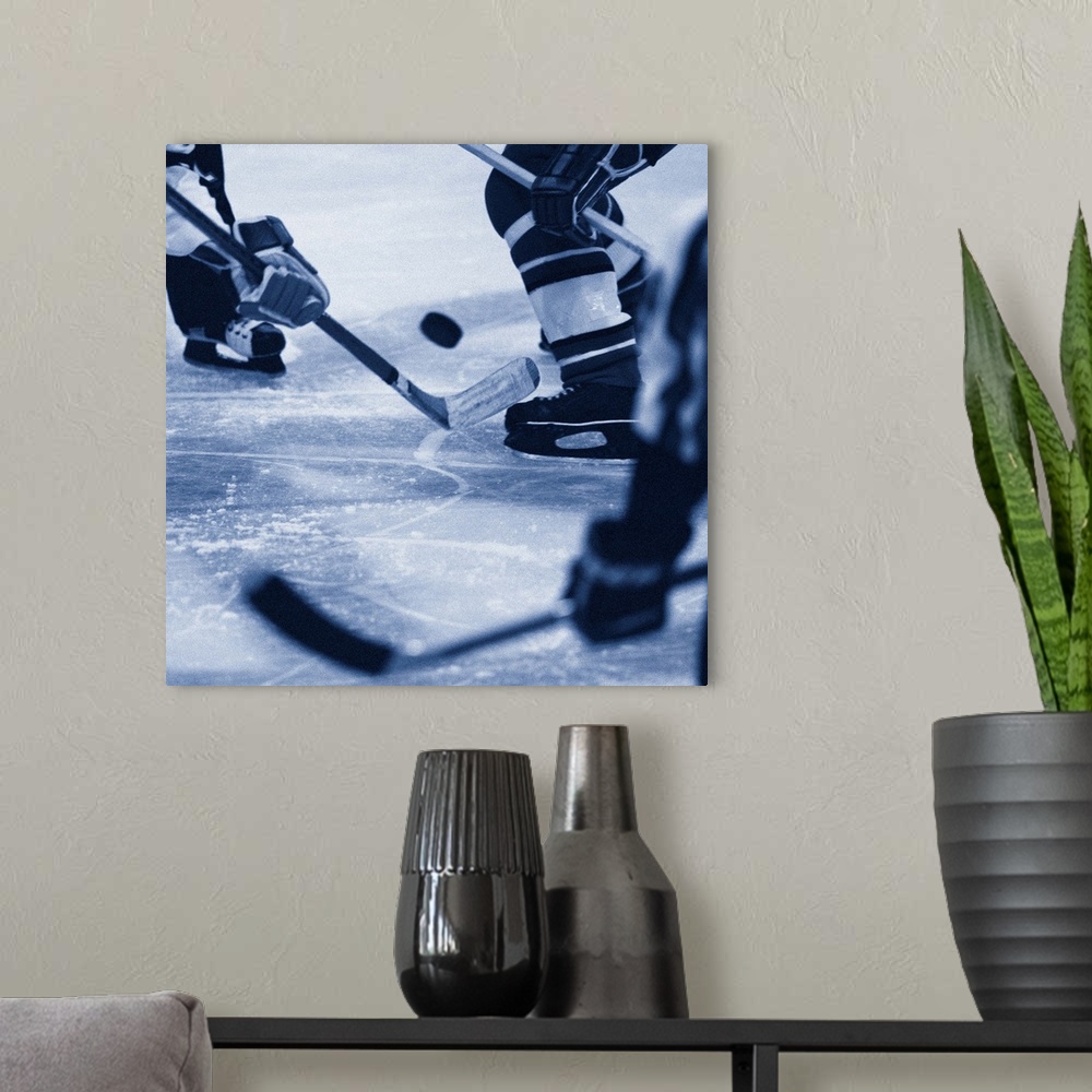A modern room featuring Ice hockey players fighting for puck (B&W)