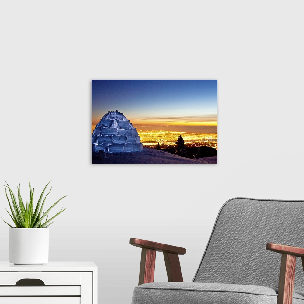 A modern room featuring Igloo illuminated on Seymour mountain just after sunset city night lights of Vancouver, Canada.