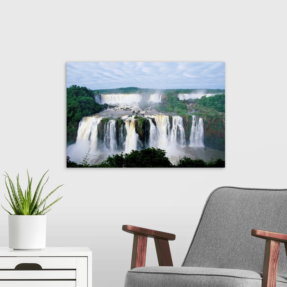 A modern room featuring A view of the Iguazu Waterfalls located in the Parque Nacional Iguazu in Brazil and Argentina.