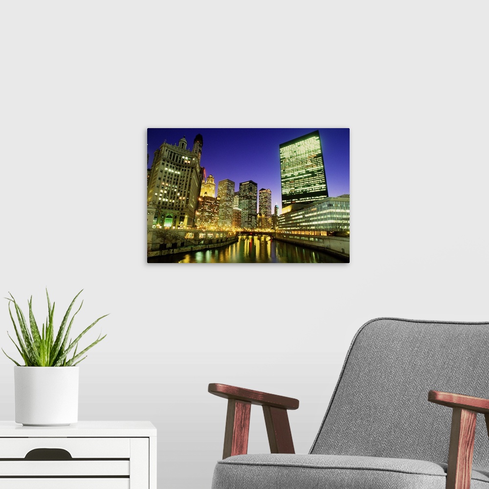 A modern room featuring USA, Illinois, Chicago, skyscrapers along River Chicago, dusk