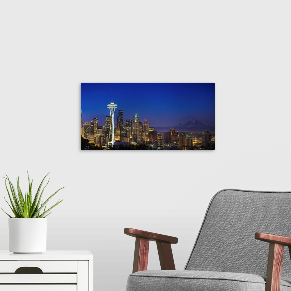 A modern room featuring Landscape photograph of the Space Needle and Mt Rainer in the distance.
