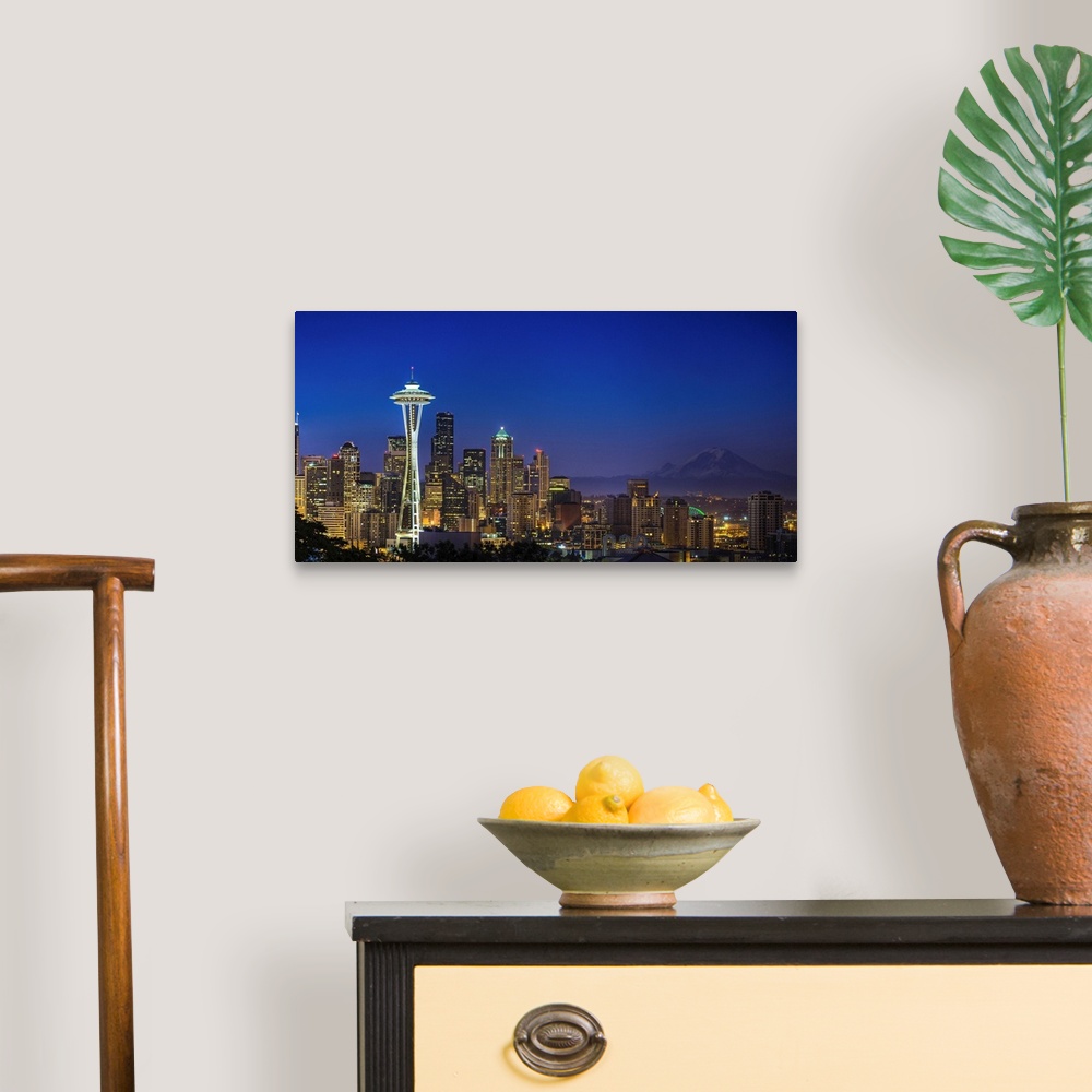 A traditional room featuring Landscape photograph of the Space Needle and Mt Rainer in the distance.