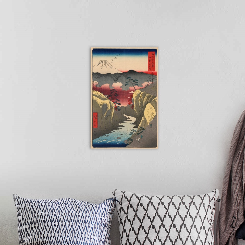 A bohemian room featuring A print from the series Thirty-Six Views of Mount Fuji by Hiroshige.