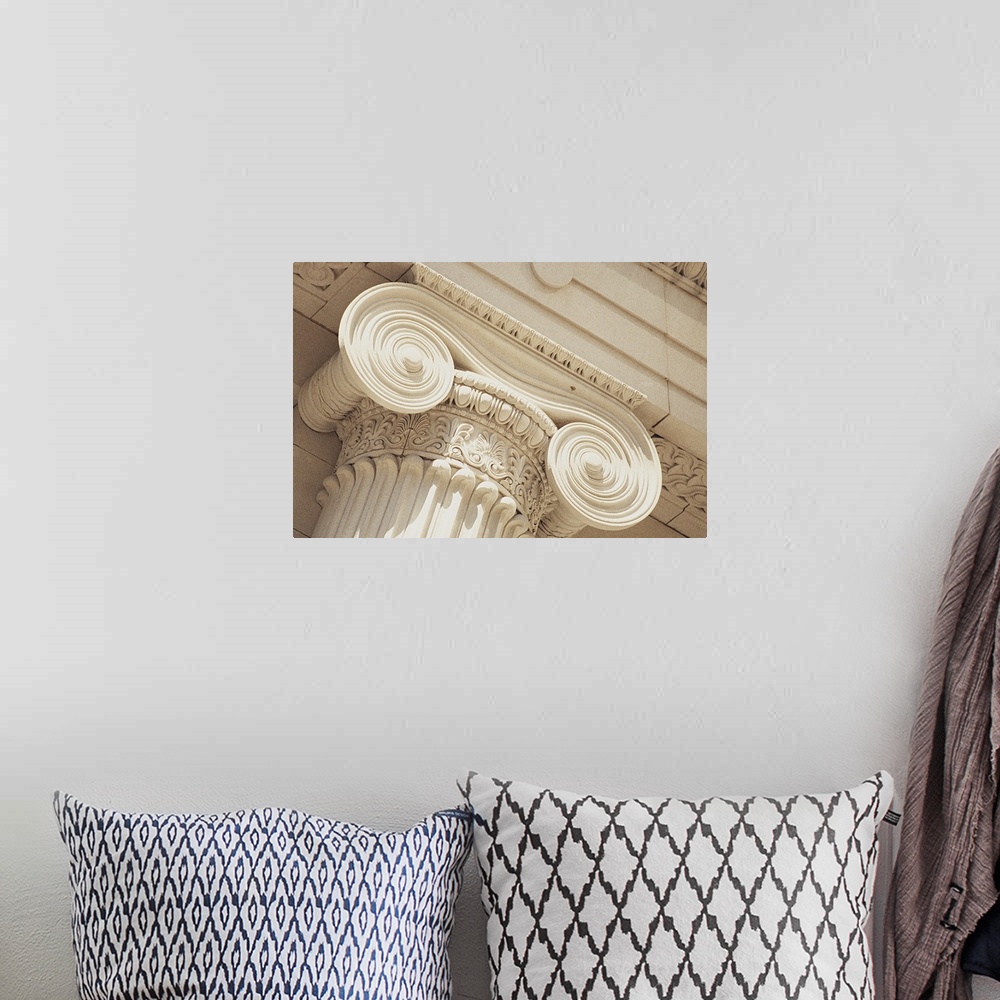 A bohemian room featuring Big canvas print of the up close view of the details etched into a column.