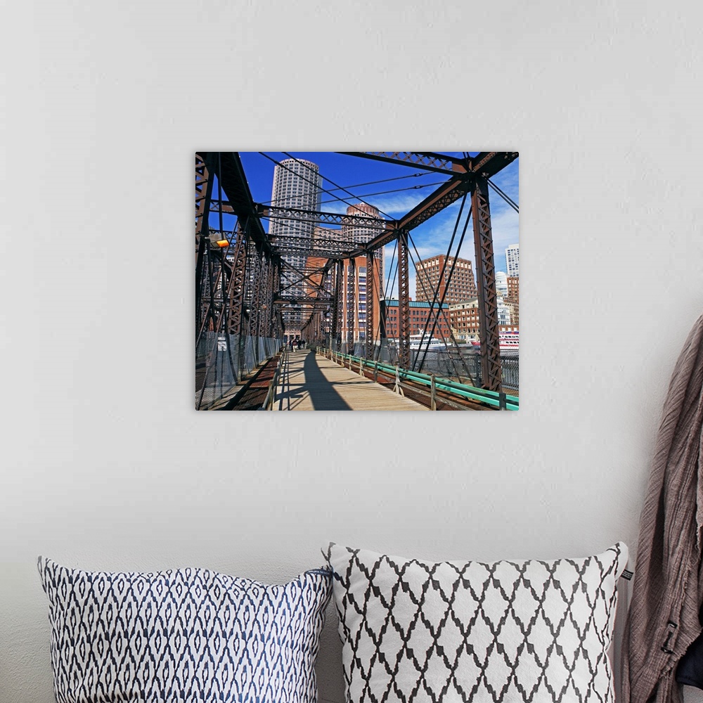 A bohemian room featuring Iron footbridge with Boston Financial district in background
