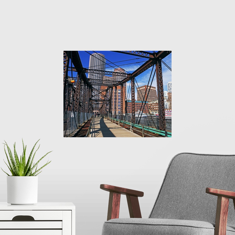 A modern room featuring Iron footbridge with Boston Financial district in background