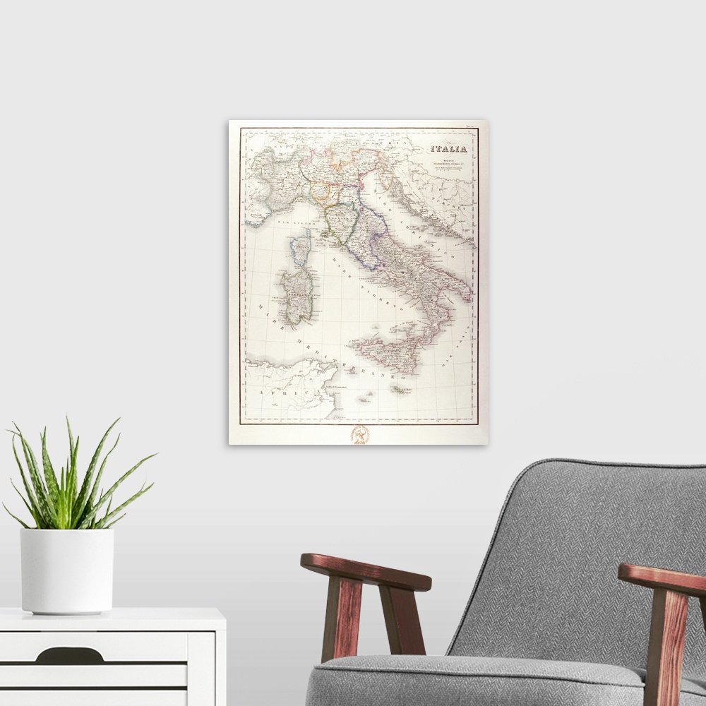A modern room featuring An antique map of Italy that has the wording in Italian.