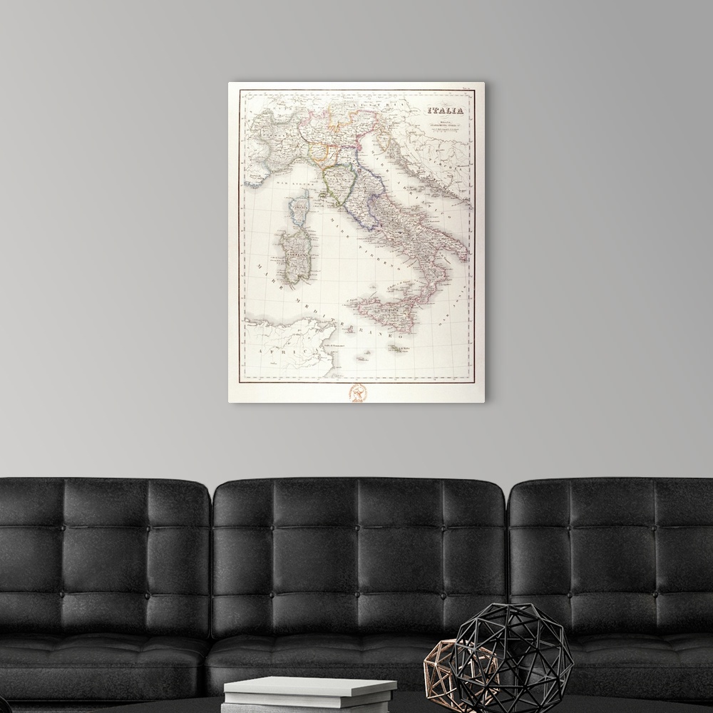 A modern room featuring An antique map of Italy that has the wording in Italian.