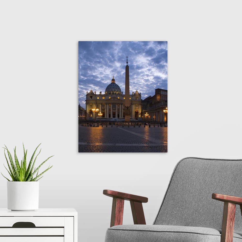 A modern room featuring Italy, Rome, Vatican City, St. Peter's Basilica illuminated at dusk