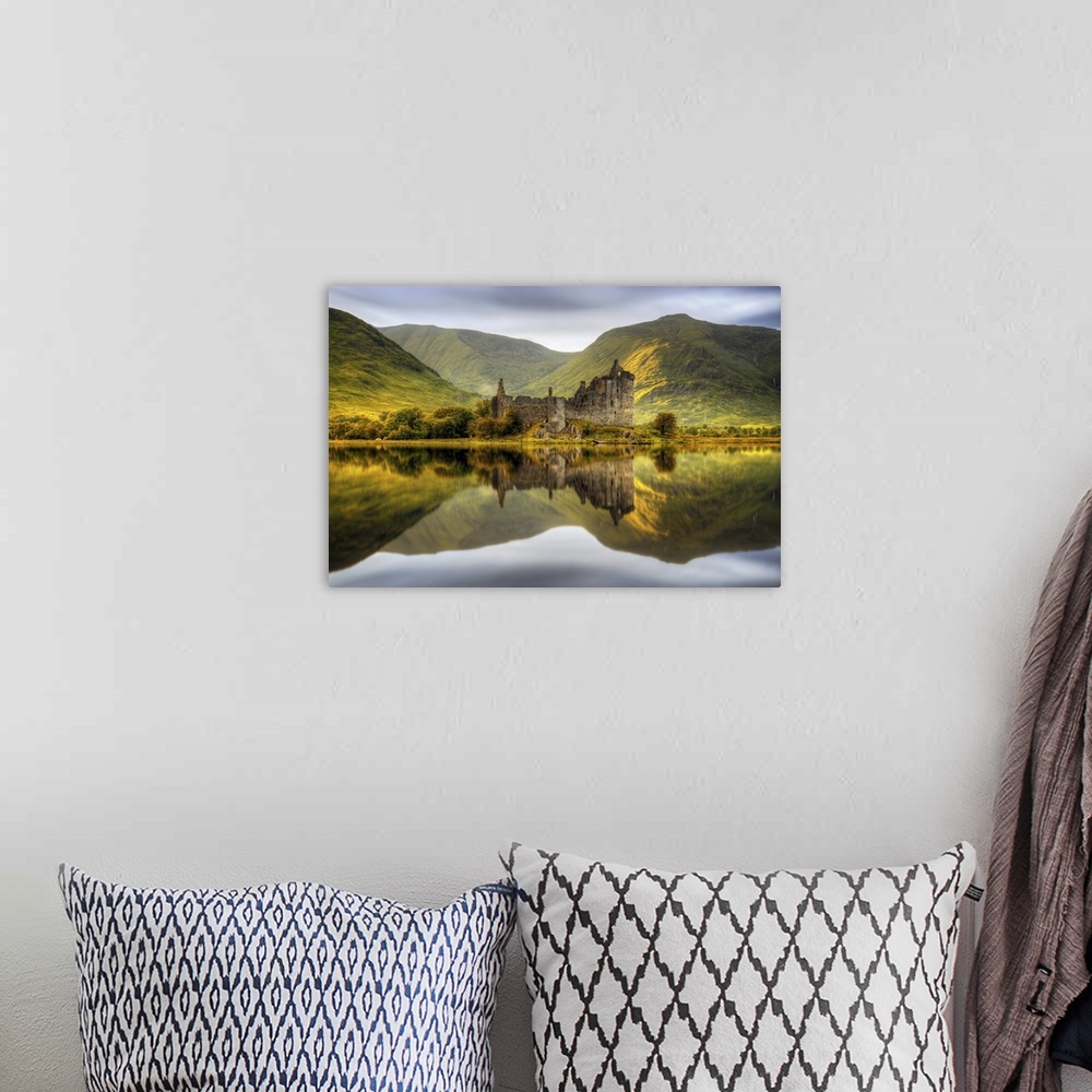 A bohemian room featuring Kilchurn Castle reflections in Loch Awe at sunset in Scotland.