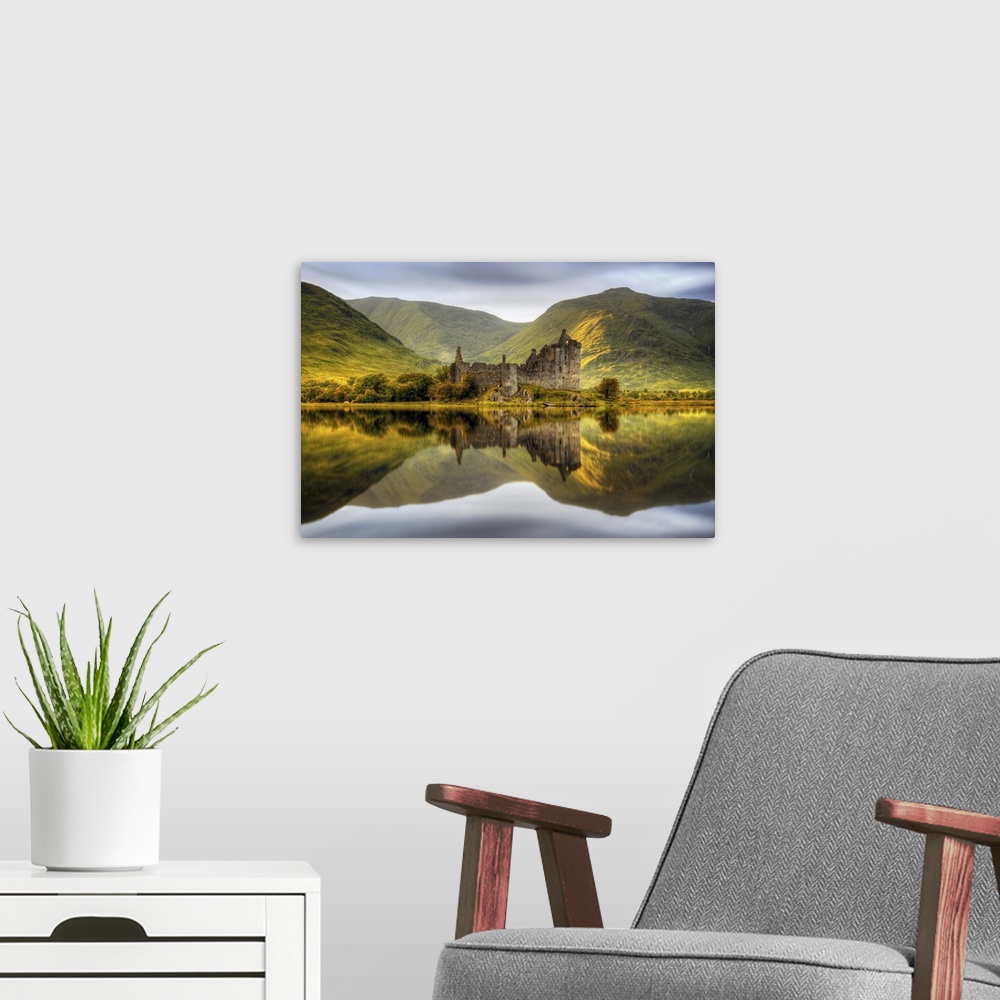 A modern room featuring Kilchurn Castle reflections in Loch Awe at sunset in Scotland.
