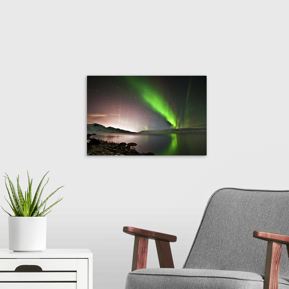 A modern room featuring Kleifarvatn lake and great aurora borealis