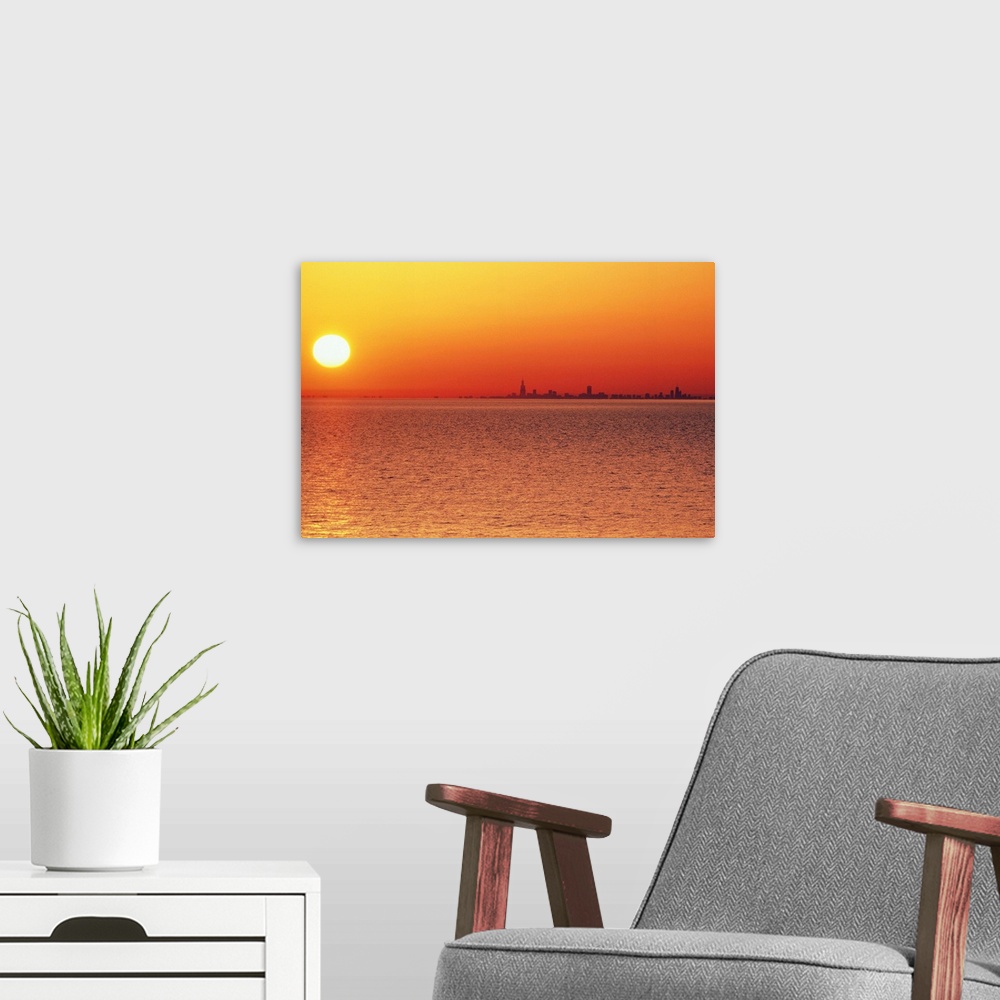 A modern room featuring USA,Chicago,Lake Michigan,orange sunset,city skyline in distance