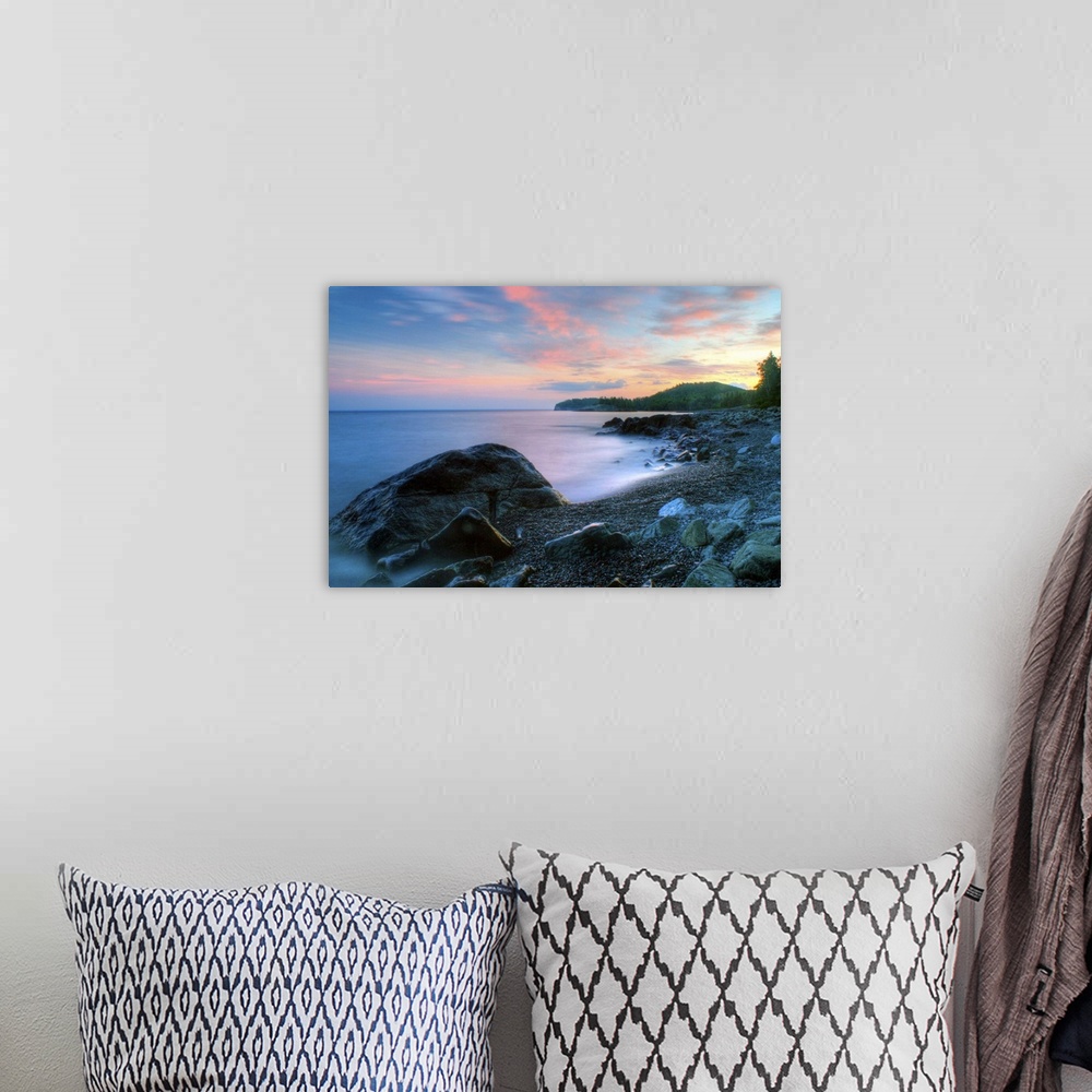 A bohemian room featuring Beautiful summer sunset along rocky shore of Lake Superior.