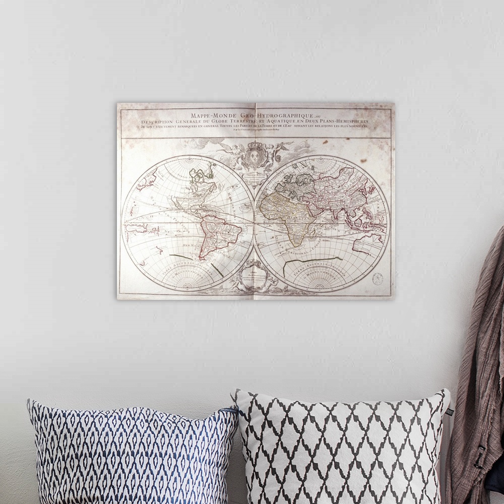 A bohemian room featuring Land and Water Map of the World