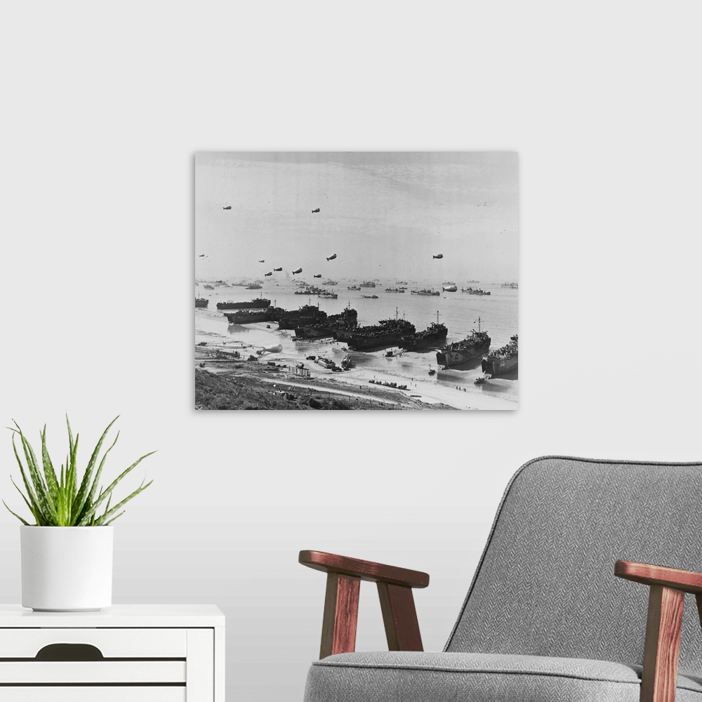 A modern room featuring A panoramic view of Omaha beach during the Normandy Landings. Barrage balloons hover over assembl...