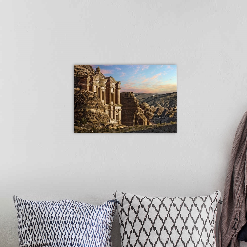 A bohemian room featuring Fantasy landscape scene from Petra, Jordan. Monastery, carved into side of rock face. rocky mount...
