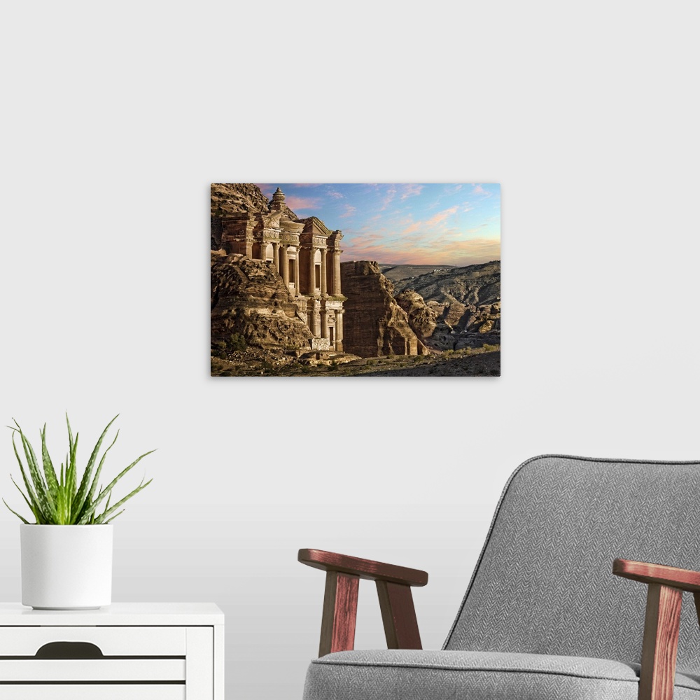 A modern room featuring Fantasy landscape scene from Petra, Jordan. Monastery, carved into side of rock face. rocky mount...