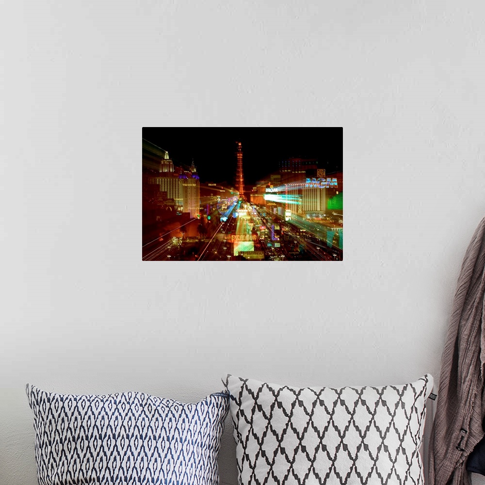 A bohemian room featuring This cityscape wall hanging is a time-lapsed photograph of the neon lights with the casino magnif...