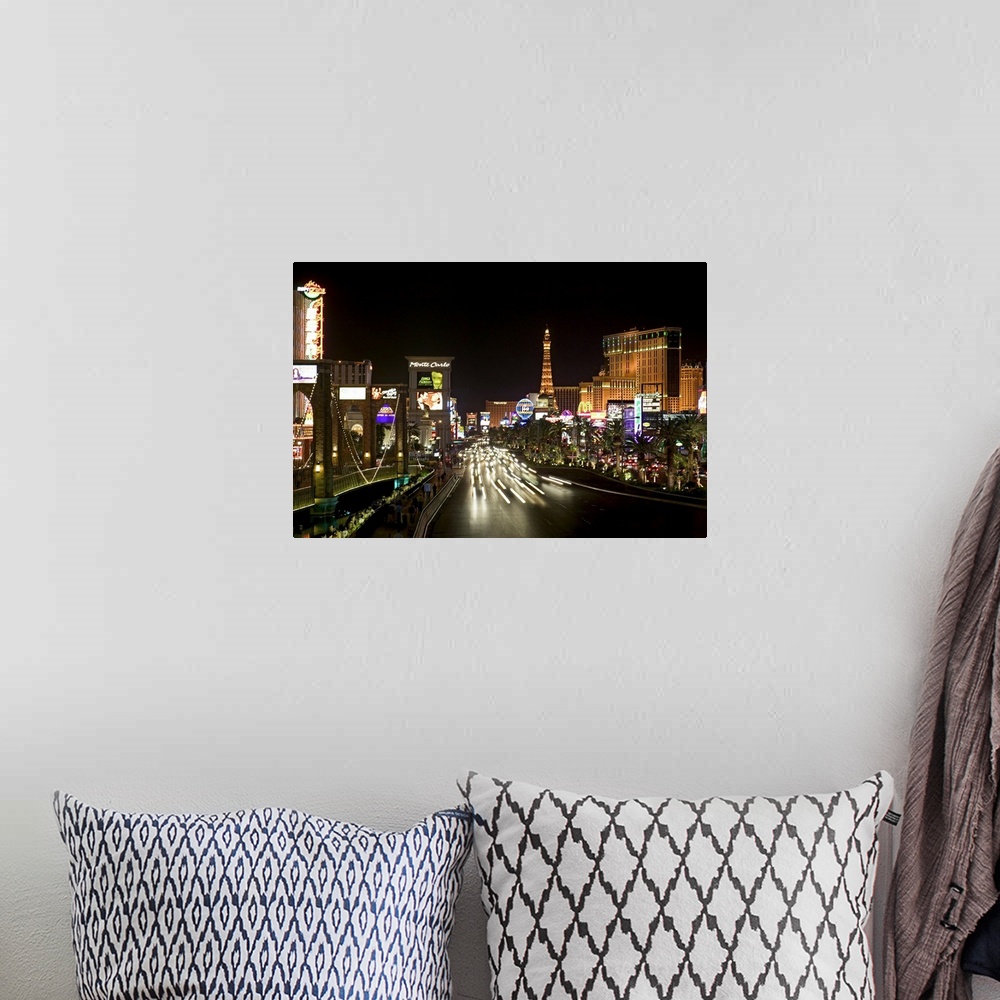 A bohemian room featuring Photograph of "Sin City" after sunset with buildings lit up in the dark sky.  A highway lined wit...