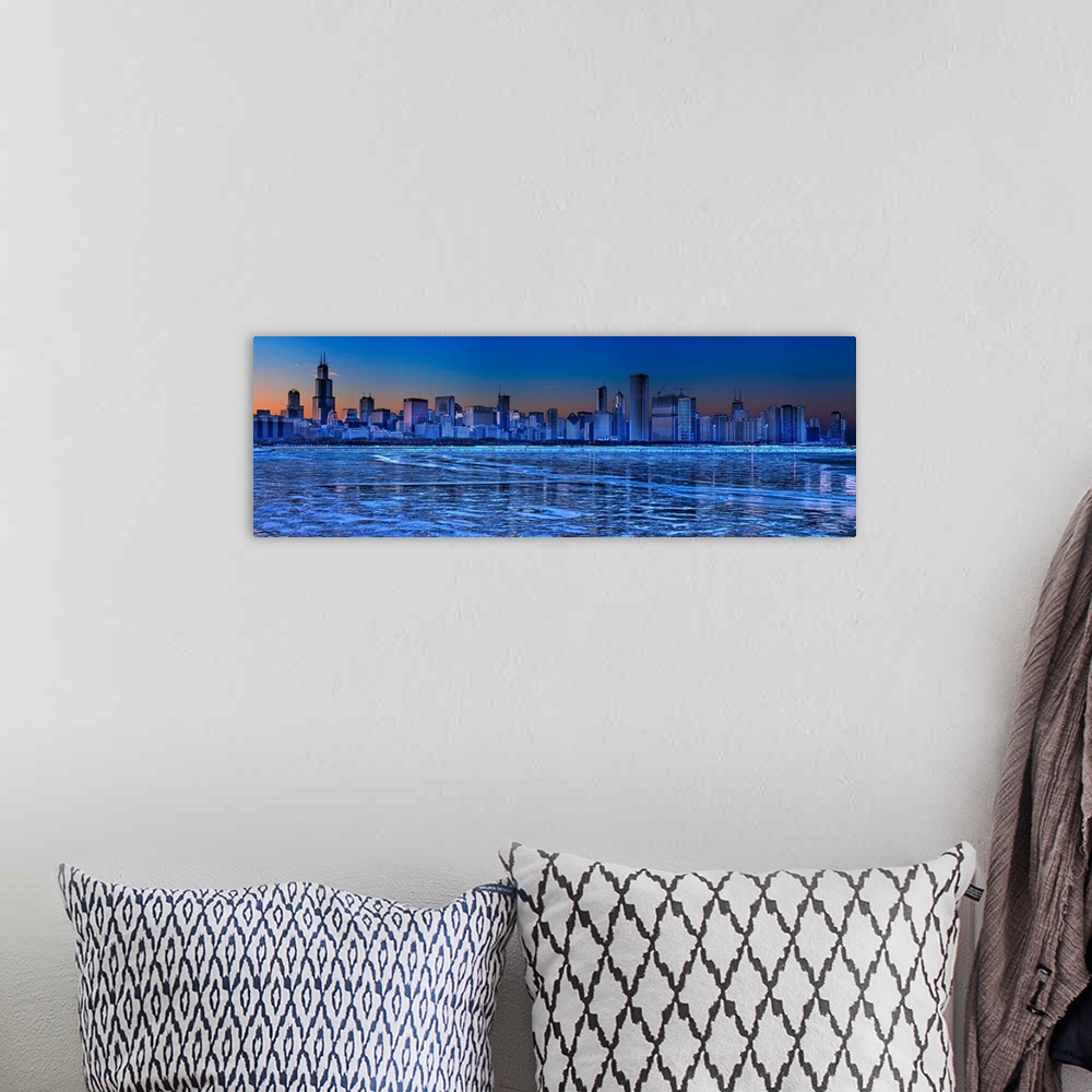 A bohemian room featuring Large, landscape photograph of the icy waters of Lake Michigan in front of the Chicago skyline at...