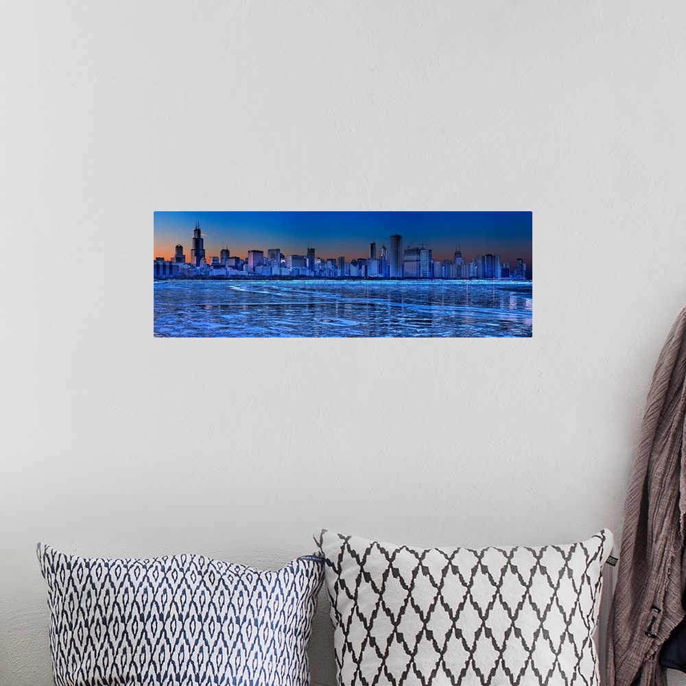 A bohemian room featuring Large, landscape photograph of the icy waters of Lake Michigan in front of the Chicago skyline at...