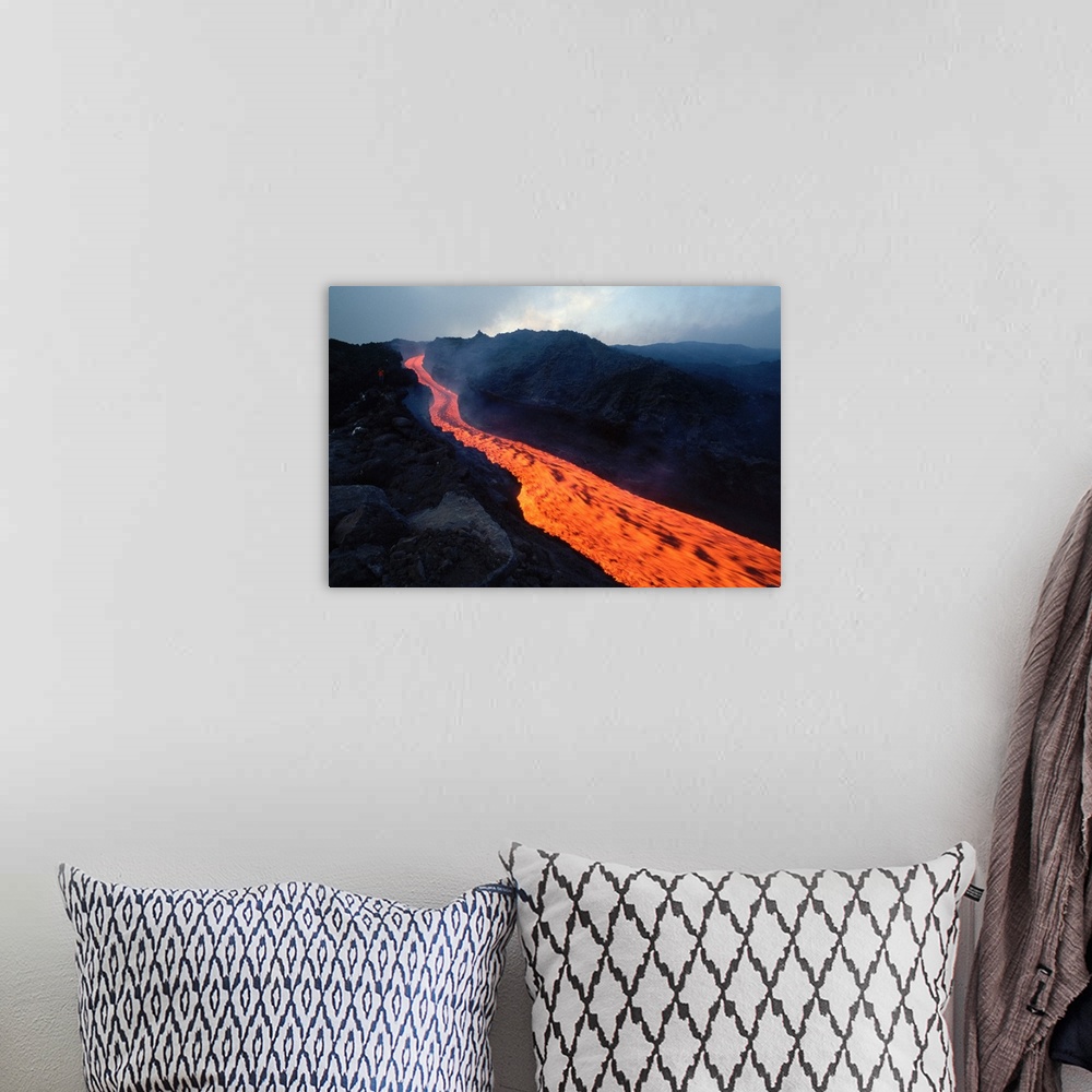 A bohemian room featuring Lava flows in a stream from Mount Etna.
