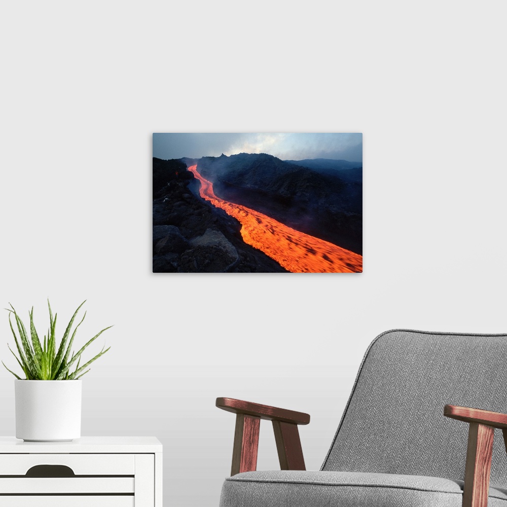 A modern room featuring Lava flows in a stream from Mount Etna.