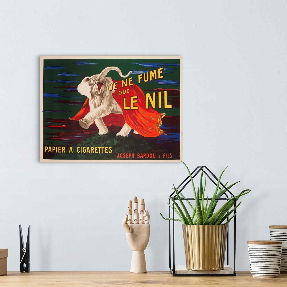 A bohemian room featuring Advertising poster showing Le Nil Elephant, illustrated by Leonetto Cappiello, 1912.