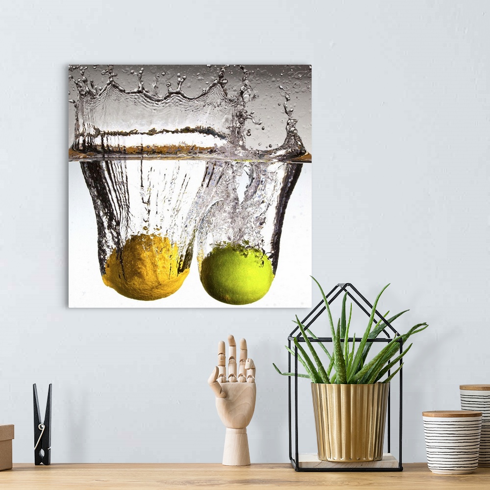 A bohemian room featuring Square canvas photo of a lime and lemon moving through water with water splashing up at the top.