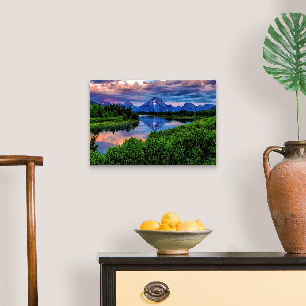 A traditional room featuring Giant, landscape photograph of morning light breaking through a stormy cloud cover over the Snake...