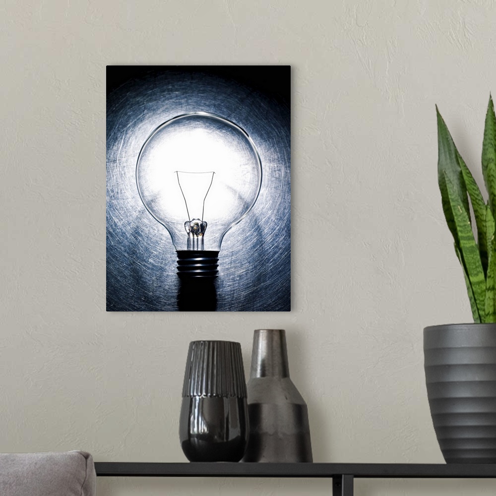 A modern room featuring Light Bulb on Stainless Steel Background.