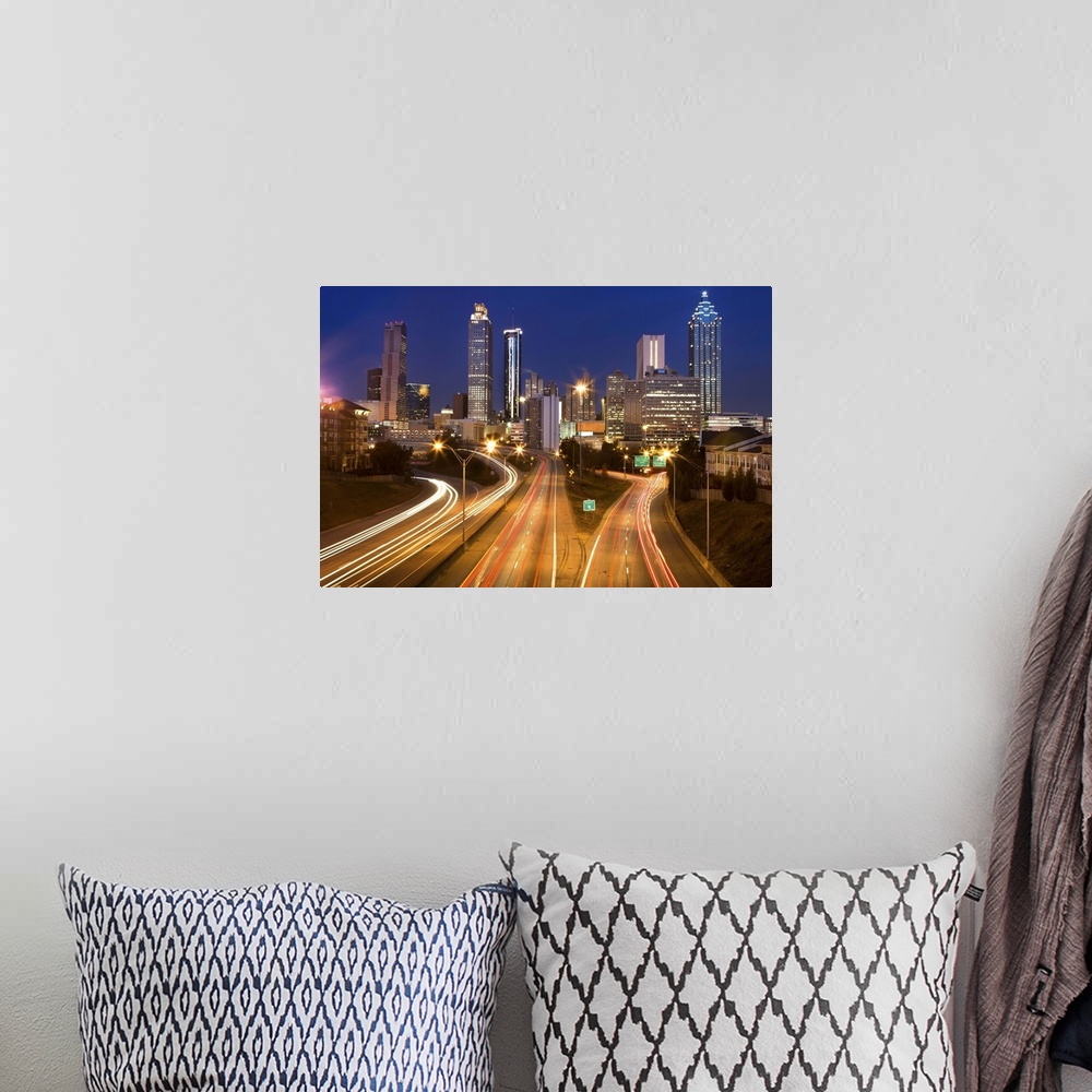 A bohemian room featuring Atlanta city office buildings and highway traffic motion blur