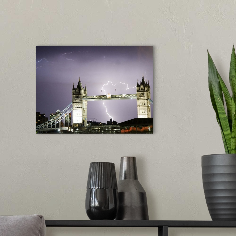 A modern room featuring Lightning storm over the city of London with Tower Bridge in the foreground
