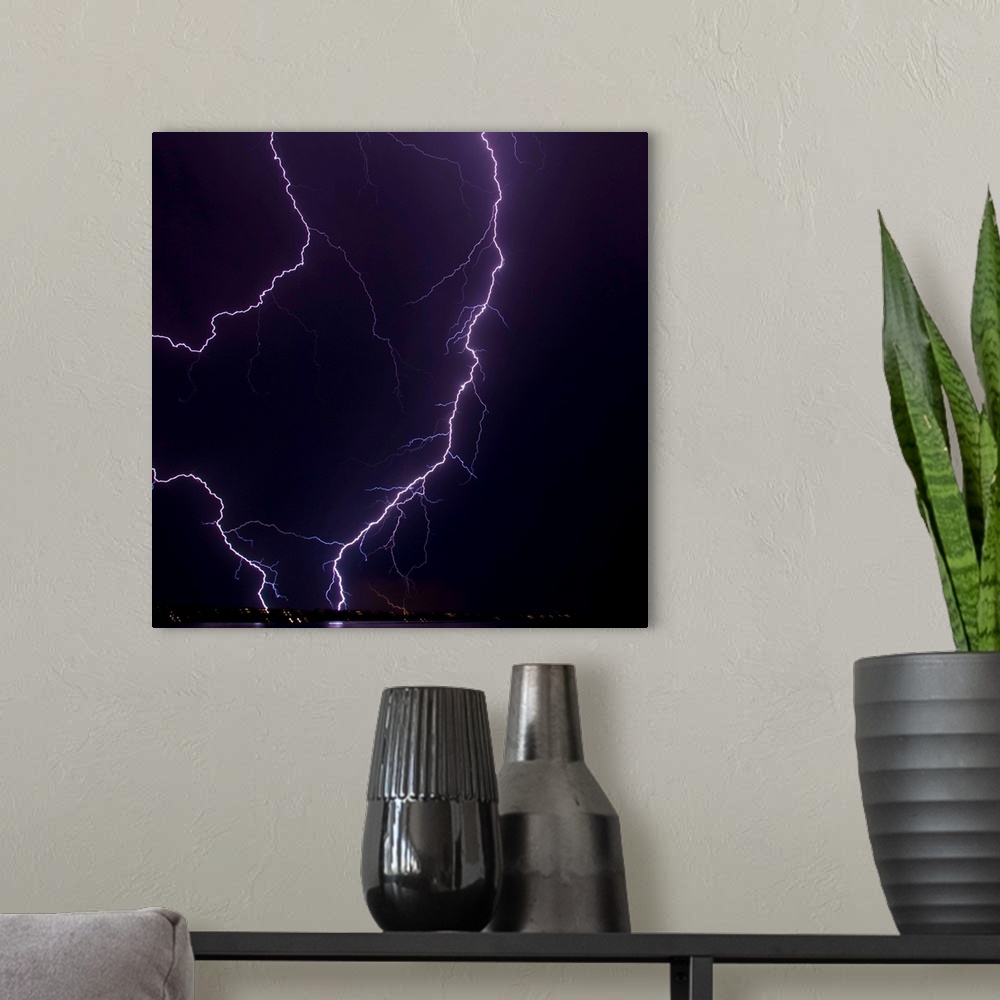 A modern room featuring An intense lightning strike near Moses Lake, Washington.