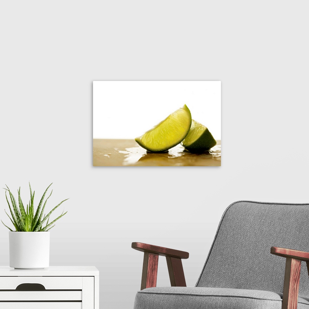 A modern room featuring Two slices of citrus fruit on a cutting board with a blank out of focus background.