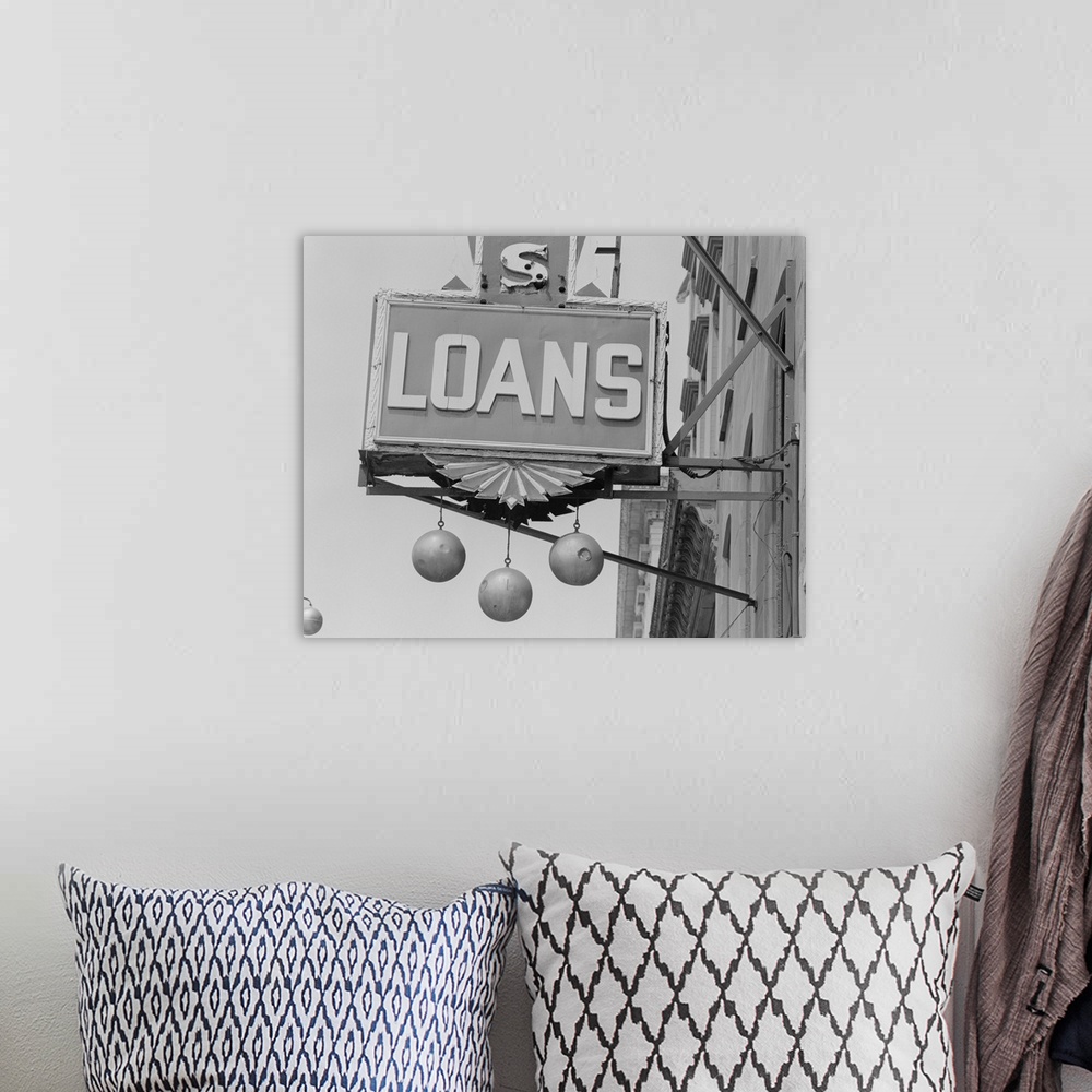 A bohemian room featuring Loans commercial sign, close-up