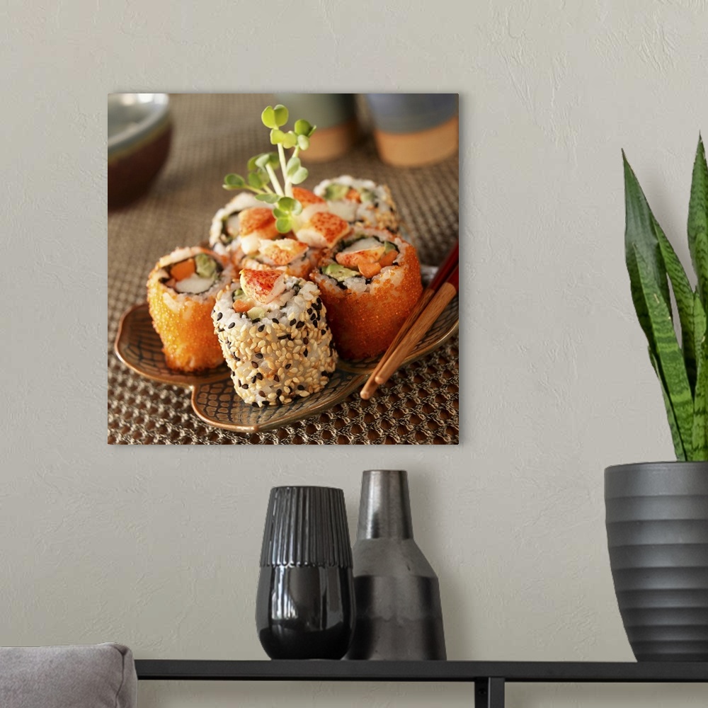A modern room featuring Lobster sushi rolls on plate