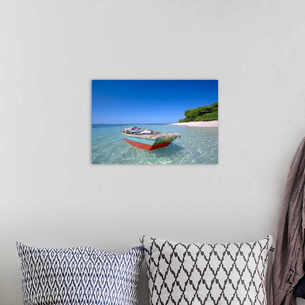 A bohemian room featuring Haiti, Nord, local boat at Isla Amiga. Isla Amiga was named and marked by Christopher Columbus on...