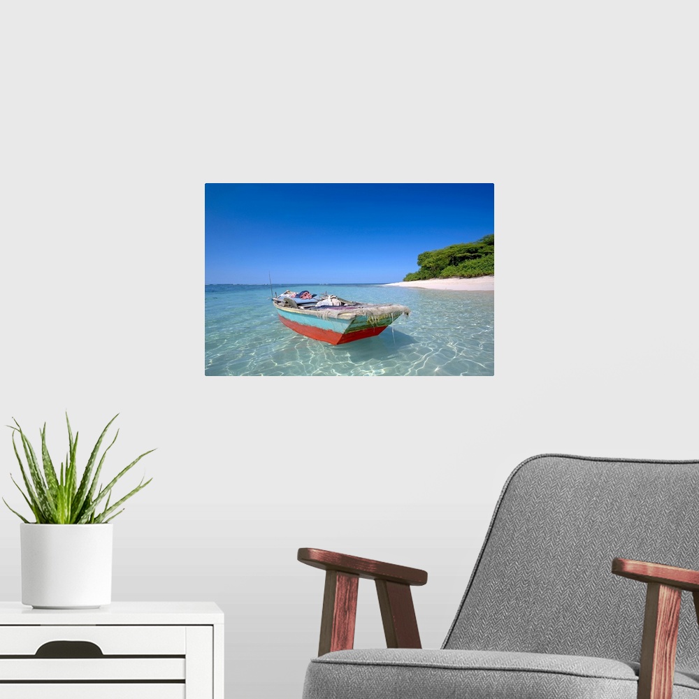 A modern room featuring Haiti, Nord, local boat at Isla Amiga. Isla Amiga was named and marked by Christopher Columbus on...