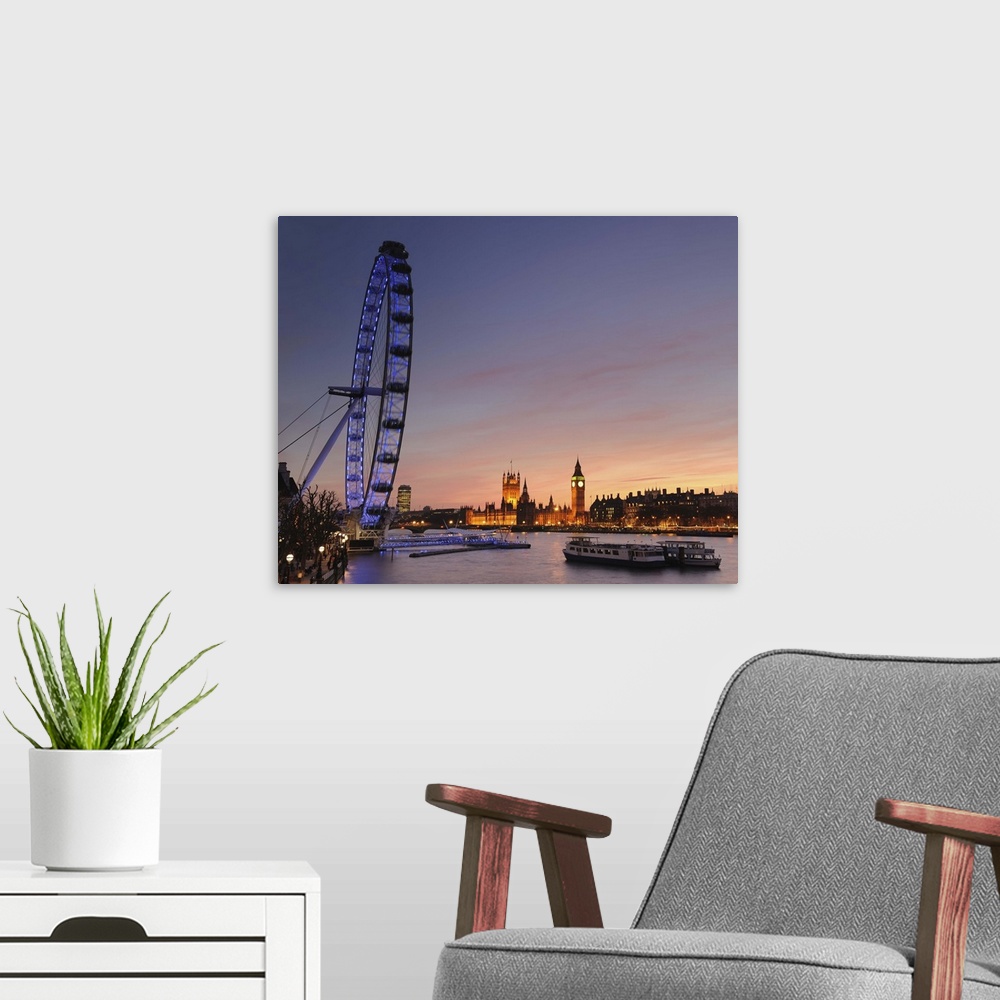 A modern room featuring View along The River Thames with the Millennium Wheel (London Eye) and Houses of Parliament at su...