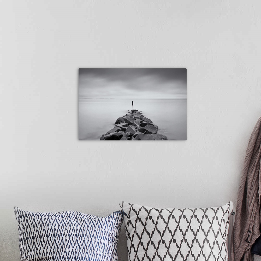 A bohemian room featuring Long exposure black and white image of rock jetty at Breezy Point.