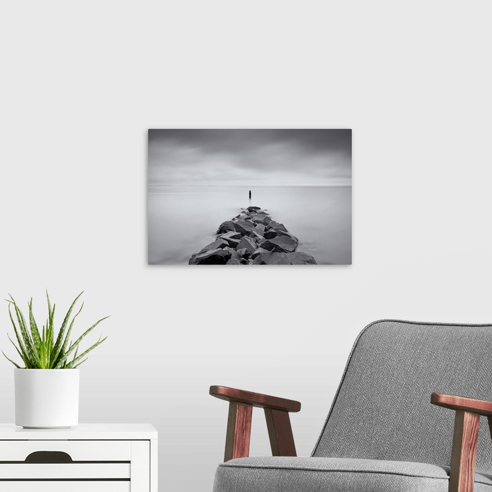 A modern room featuring Long exposure black and white image of rock jetty at Breezy Point.