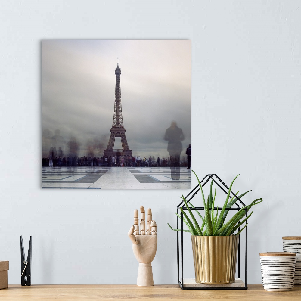 A bohemian room featuring Long exposure of Eiffel Tower with figures in crowds blur in Paris.