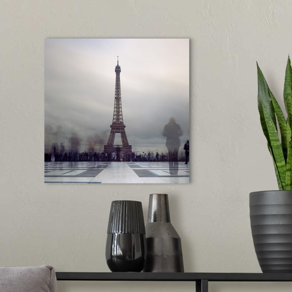 A modern room featuring Long exposure of Eiffel Tower with figures in crowds blur in Paris.