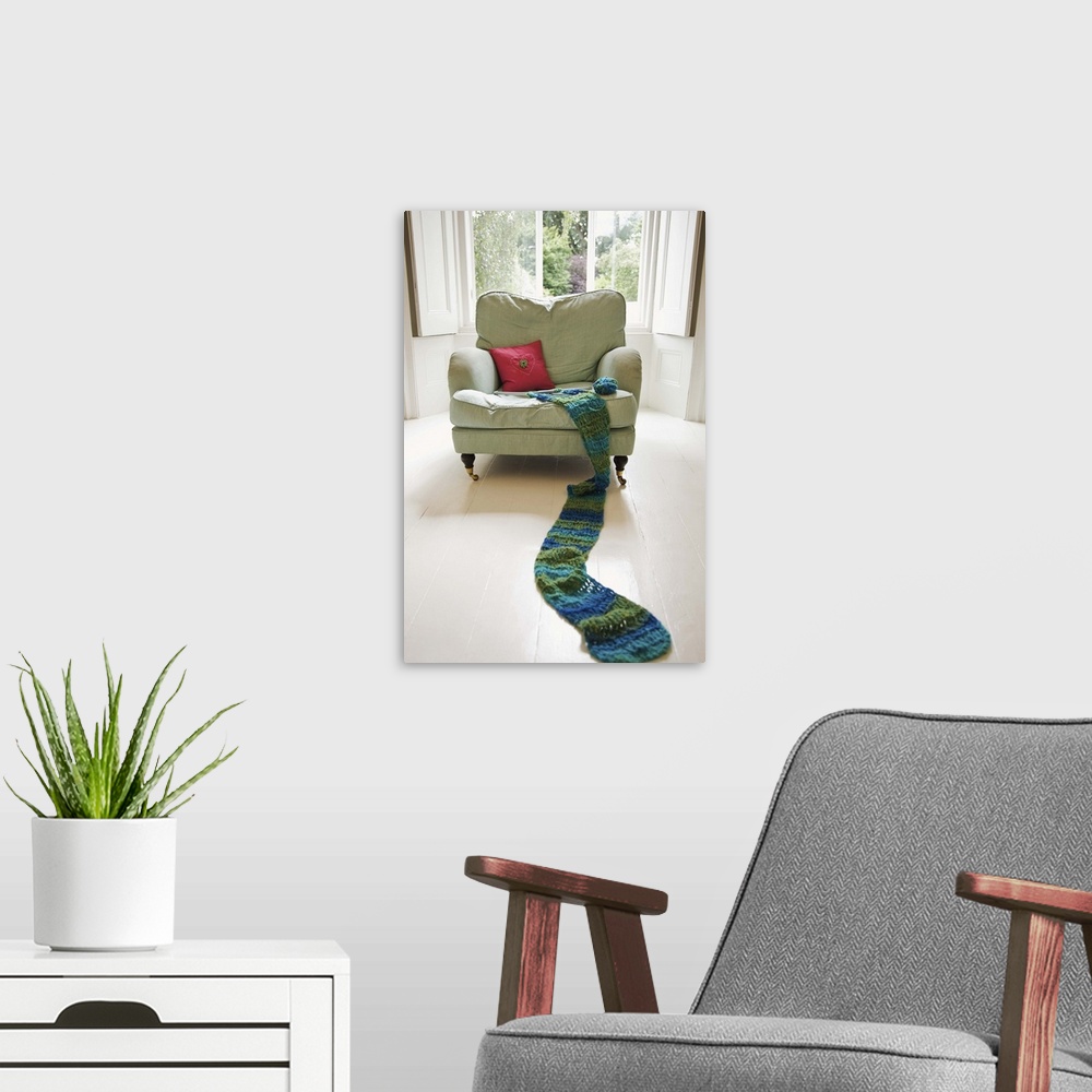A modern room featuring Long knitted scarf on chair