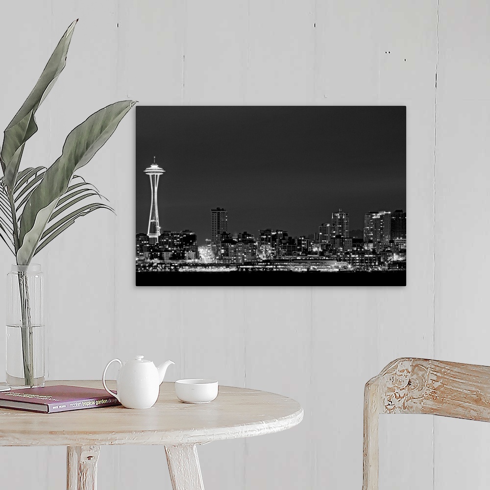 A farmhouse room featuring Black and white photograph taken of the city skyline in Seattle with the city illuminated under a...