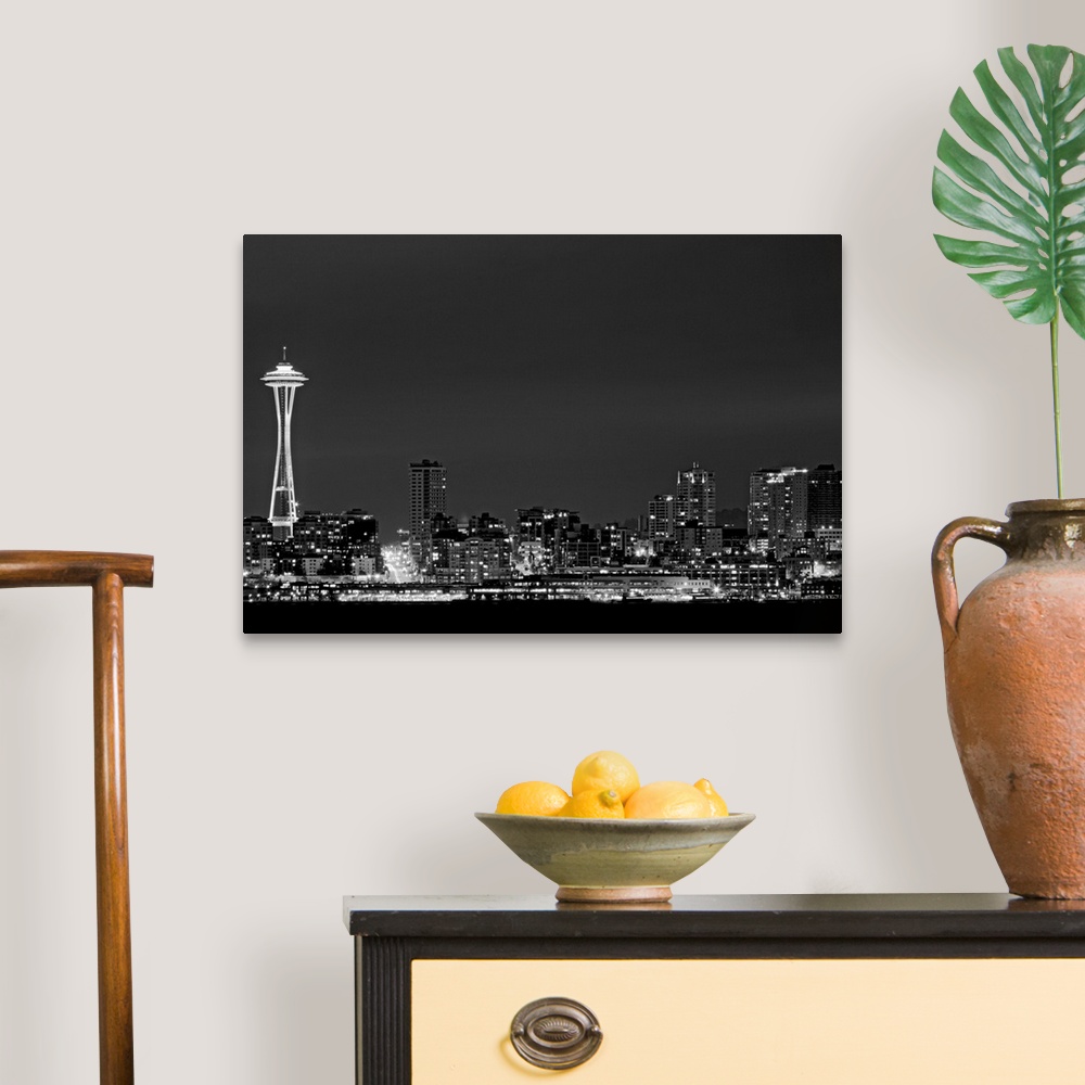 A traditional room featuring Black and white photograph taken of the city skyline in Seattle with the city illuminated under a...