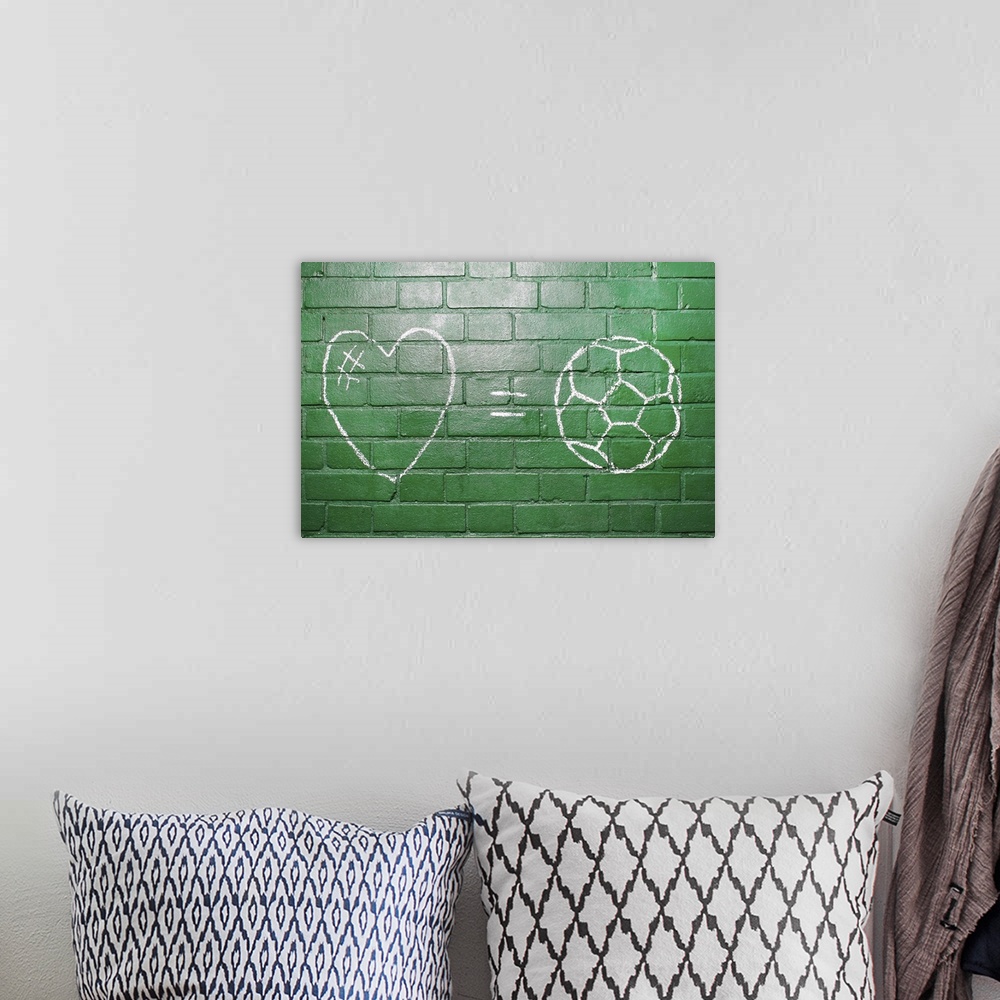 A bohemian room featuring Love = Football drawn in chalk on wall.